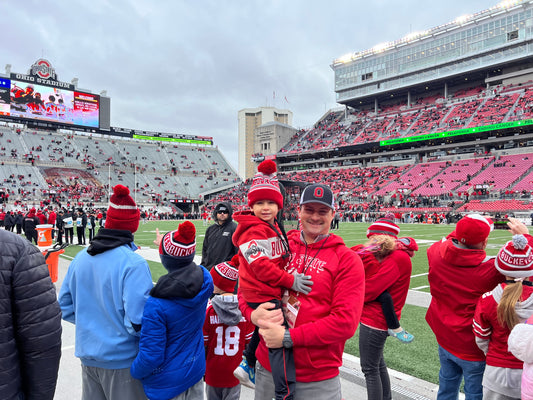 Tips for taking your kid to a football game (without losing your mind)
